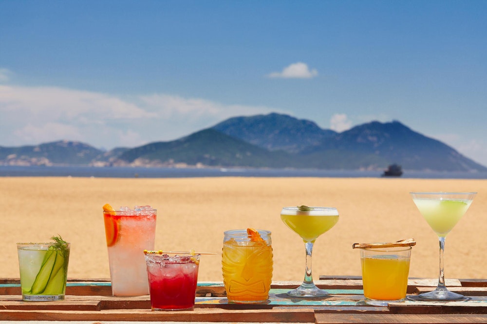 Limewood Hong Kong cocktails on table with beach view