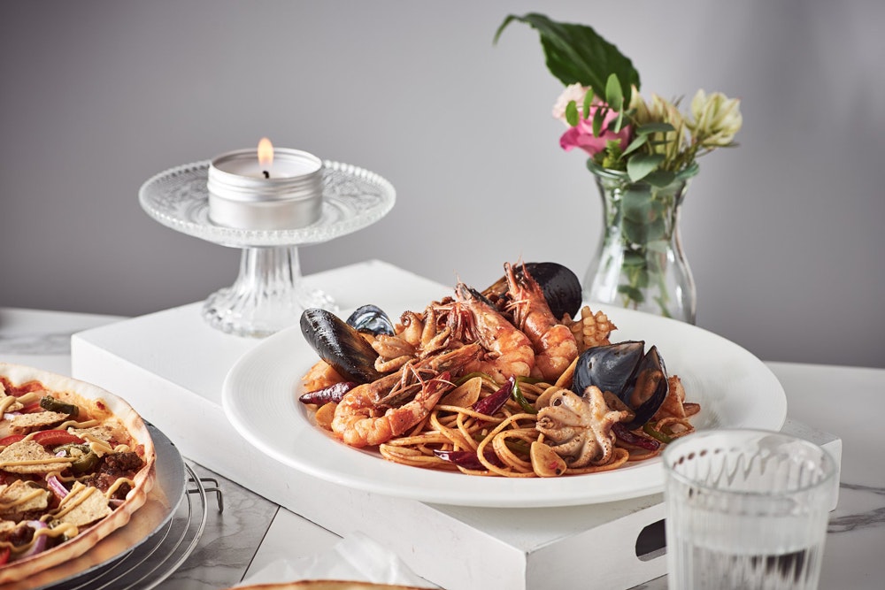 Mad for Garlic seafood pasta dish with flowers