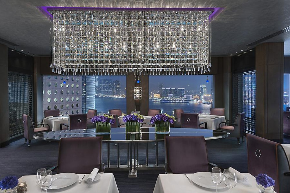 Pierre restaurant interior with city at dusk view