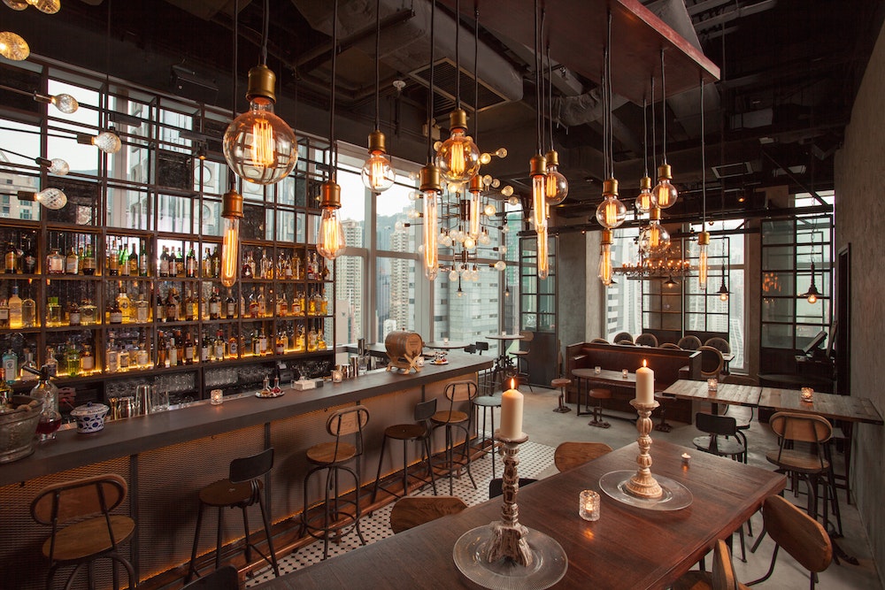 Pirata restaurant interior bar area with low lights and candles