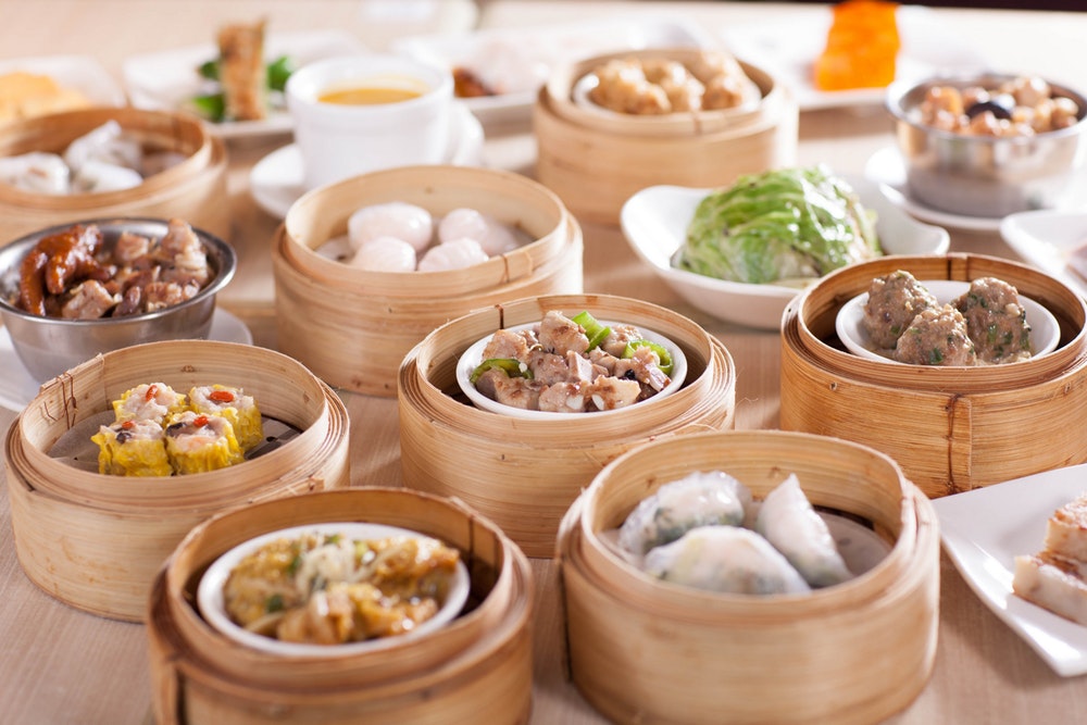 Tim Ho Wan restaurant variety of dim sum in steamer baskets
